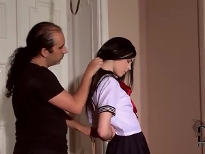 He puts submissive schoolgirl into rope bondage