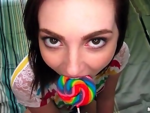 Lollipop licking teen girl sucks on a cock