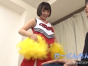 Japanese cheerleader gives a handjob and a blowjob