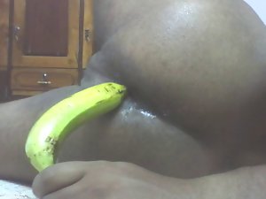 Me screwing my butt with banana wishing it was a perfect cock.