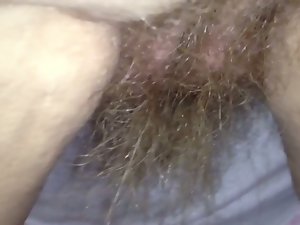 her long pubic hair hanging from her rear.