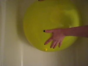 My Girlfriend popping a giant water balloon with her nails.