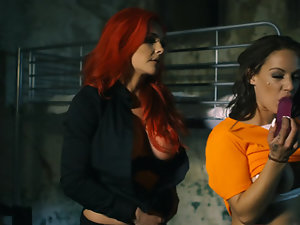 Two girls in a prison cell fuck one another like crazy